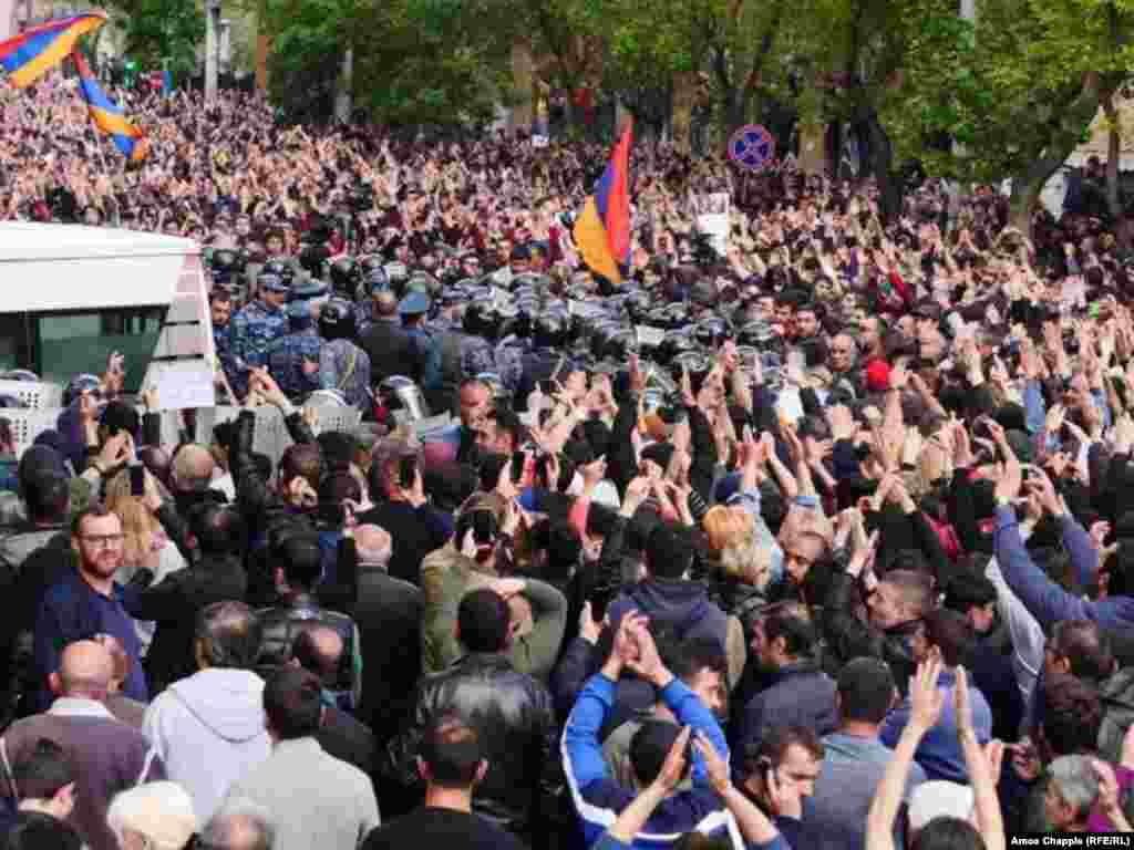 Protesters gather outside a police station in Yerevan.