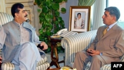 Pakistani Prime Minister Yousuf Raza Gilani (left) meets with ISI Director-General Ahmed Shuja Pasha in Islamabad in December.