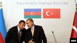 Azerbaijani President Ilham Aliyev (left) and Turkish Prime Minister Tayyip Erdogan in a June 2012 meeting at a Trans-Anatolian Natural Gas Pipeline Project signing ceremony in Istanbul.