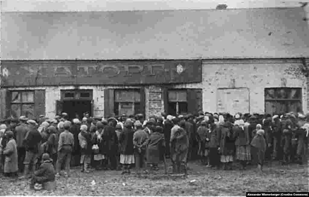 The empty &quot;Chartorg&quot; (Charower Trade Cooperative)&nbsp;food distribution site is besieged by a devastated population in Kharkiv..