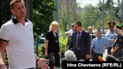 Russian opposition blogger Aleksei Navalny talks to reporters before meeting with police investigators on July 31. 